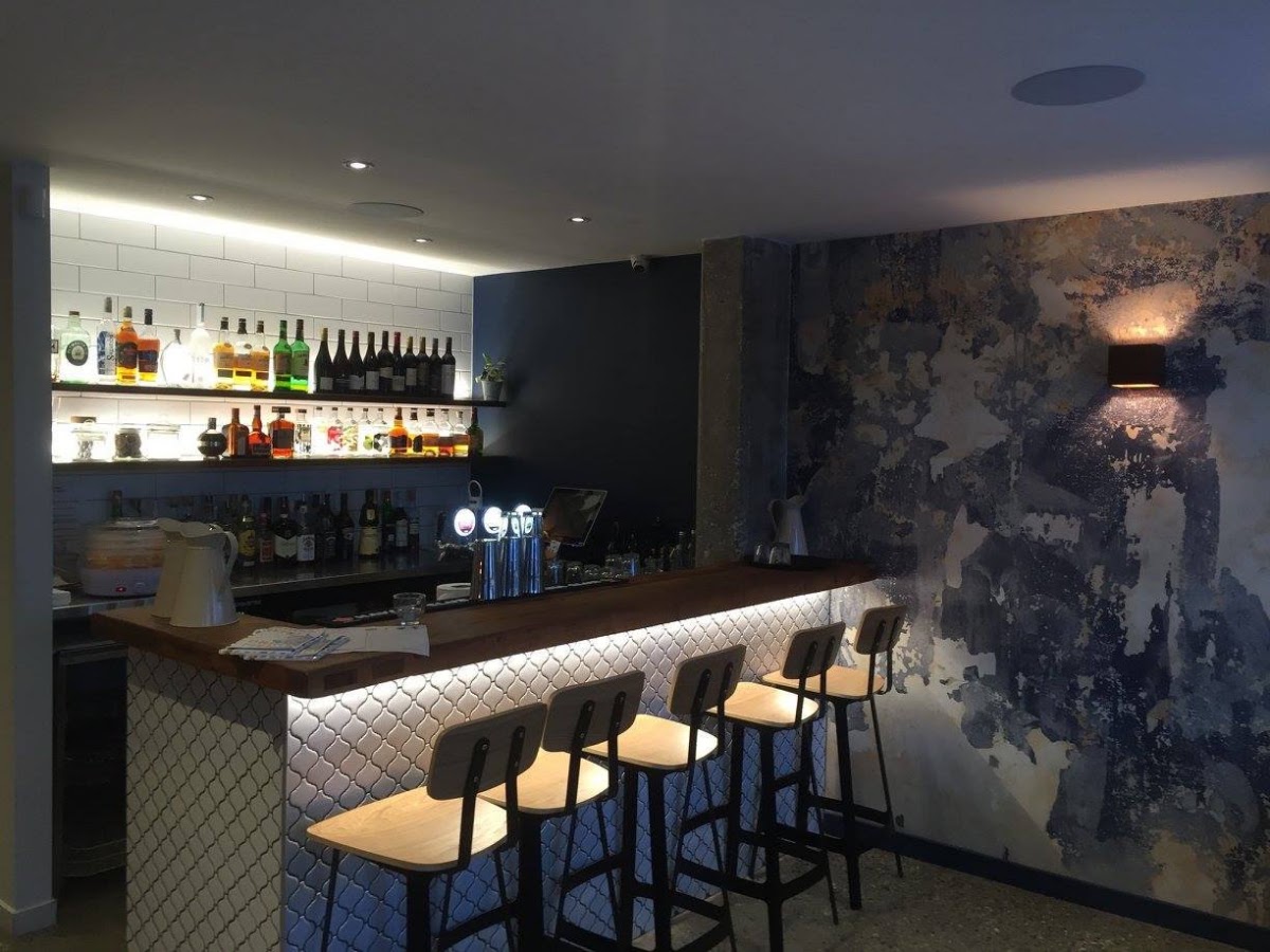 Bar with LED strip shelf lighting