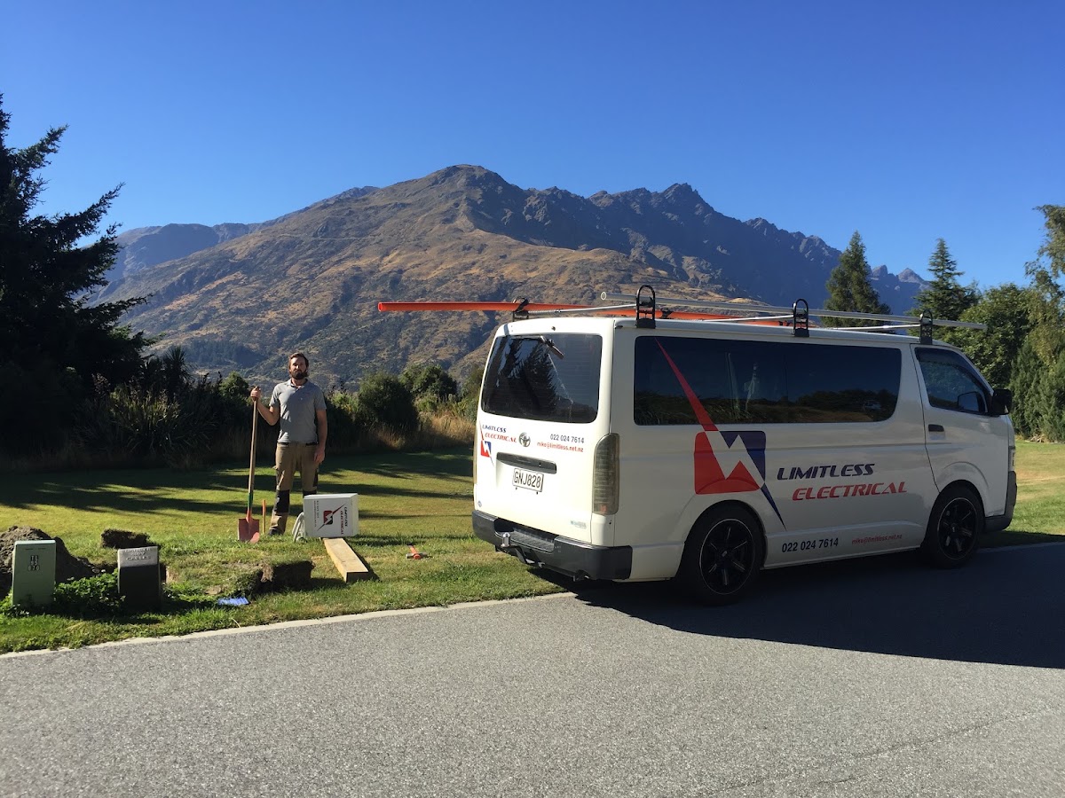 Mike beside the Limitless Electrical van on a job